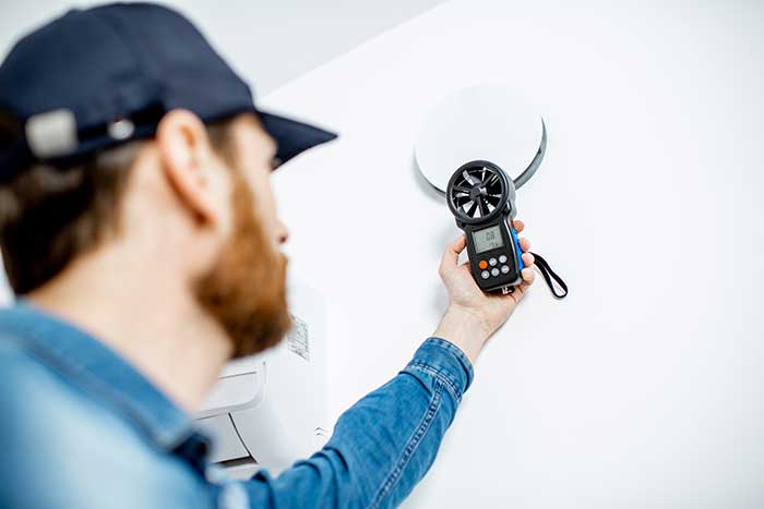 Technician checking air ventilation