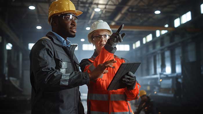 Engineers Stand in Steel Metal Manufacturing Factory