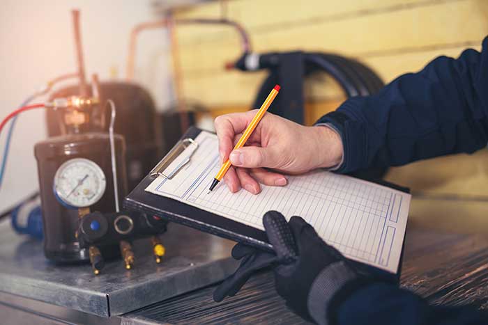 Refrigerant Compliance Manager checking dials