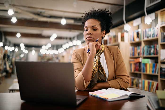 Woman studying on laptop